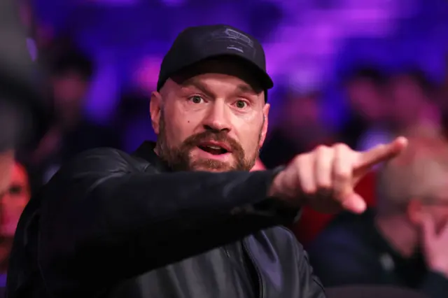 Tyson Fury points at ringside