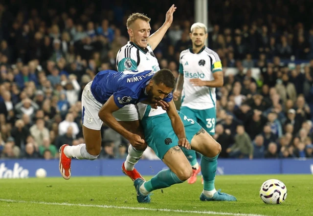 s Dominic Calvert-Lewin in action with Newcastle United's Dan Burn