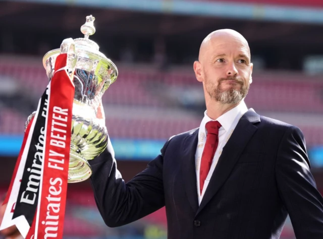 Erik ten Hag poses with the FA Cup