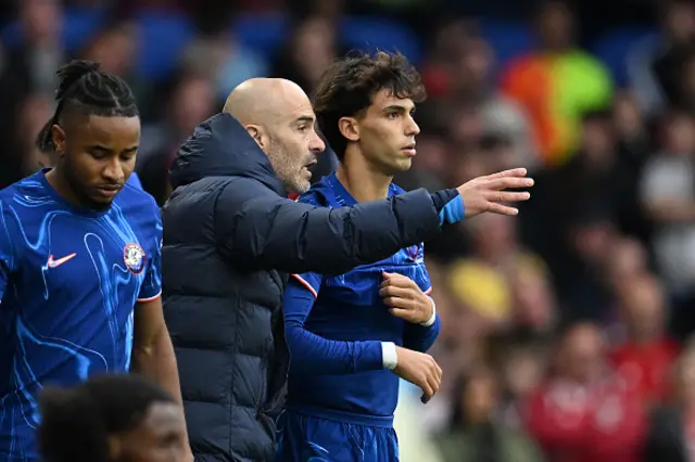 Enzo Maresca, Manager of Chelsea, interacts with Joao Felix