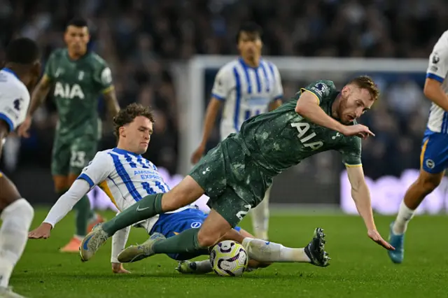 Dejan Kulusevski (R) is tackled by Brighton's Dutch defender Mats Wieffer