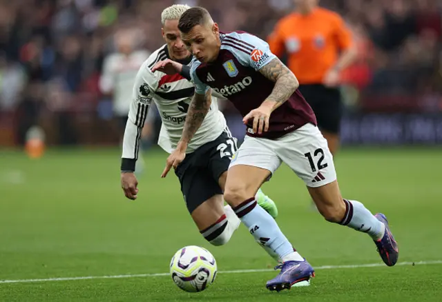 Antony (L) vies with Aston Villa's French defender #12 Lucas Digne