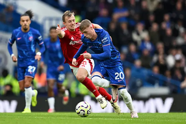 Cole Palmer of Chelsea is challenged by James Ward-Prowse