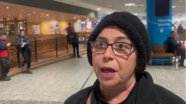 A woman standing in an airport