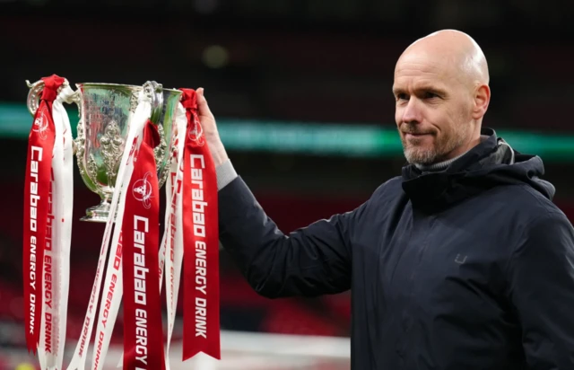 Erik ten Hag poses with the League Cup