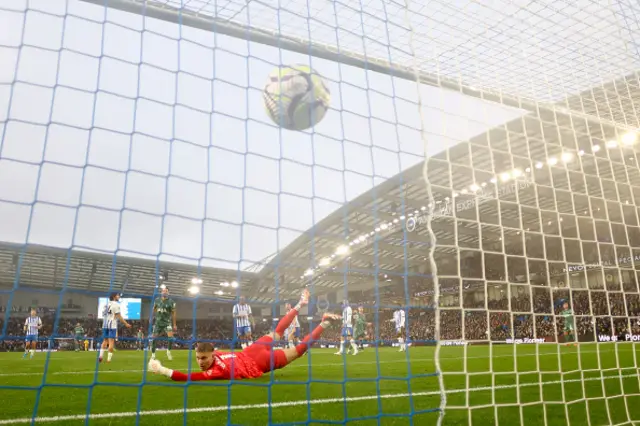 Bart Verbruggen of Brighton & Hove Albion fails to save a shot from James Maddison