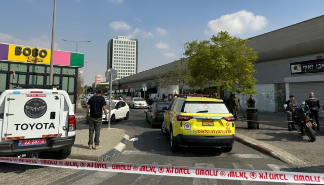 Emergency services at the scene of a shooting outside a bus station in Beersheba