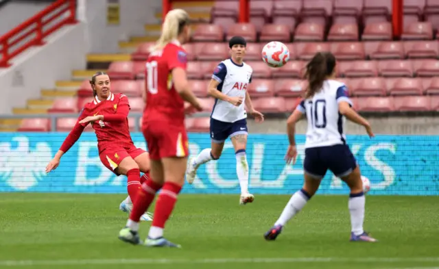 Cornelia Kapocs lobs Tottenham's Becky Spencer to score Liverpool's first goal