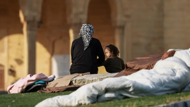 Displaced people wake up by their makeshift shelters in central Beirut, Lebanon