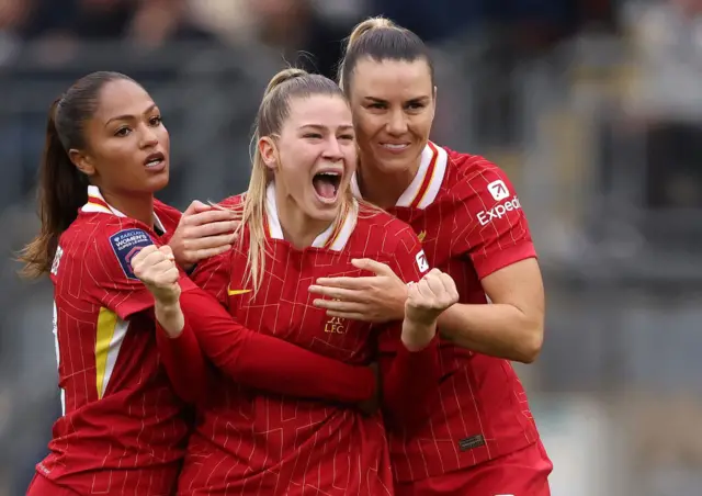 Liverpool's Marie Hobinger celebrates after scoring a late winning penalty against Tottenham