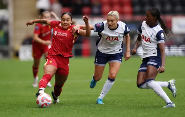 Olivia Smith tries to run past Amanda Nilden and Jess Naz