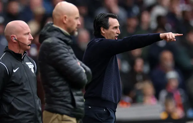 Unai Emery (R) watches the players from the touchline