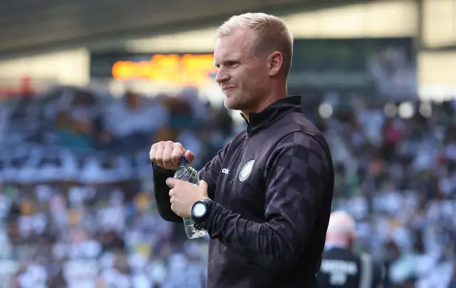 Liam Manning on the sidelines