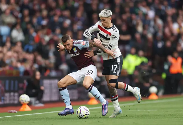 Lucas Digne of Aston Villa is challenged by Alejandro Garnacho