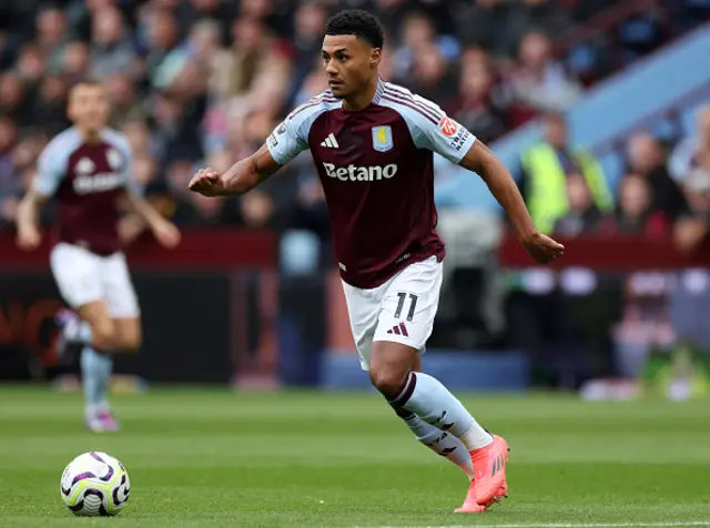 Ollie Watkins runs with the ball