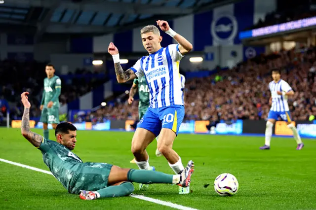 Julio Enciso of Brighton & Hove Albion is challenged by Cristian Romero