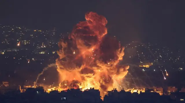 Description Smoke and flames rise in Beirut's southern suburbs, after Israeli air strikes, amid ongoing hostilities between Hezbollah and Israeli forces, as seen from Sin El Fil, Lebanon, October 6, 2024.