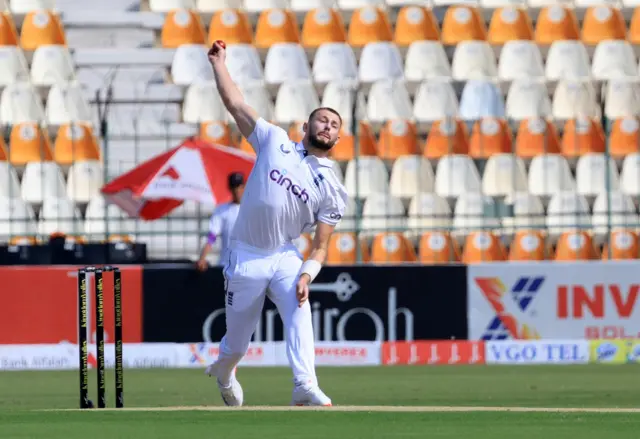 England's Gus Atkinson bowls