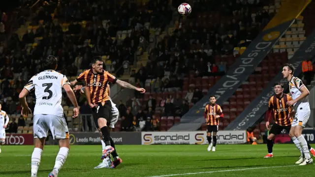 Andy Cook heads Bradford into the lead against Newport