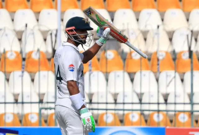 Pakistan's Shan Masood celebrates after reaching his century