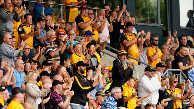 Newport fans celebrate a goal