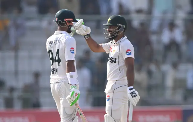 Abdullah Shafique celebrates his century with Shan Masood