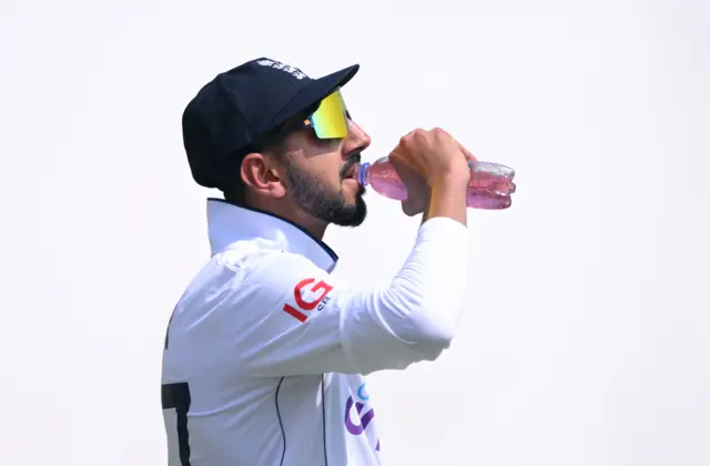 Shoaib Bashir takes a drink