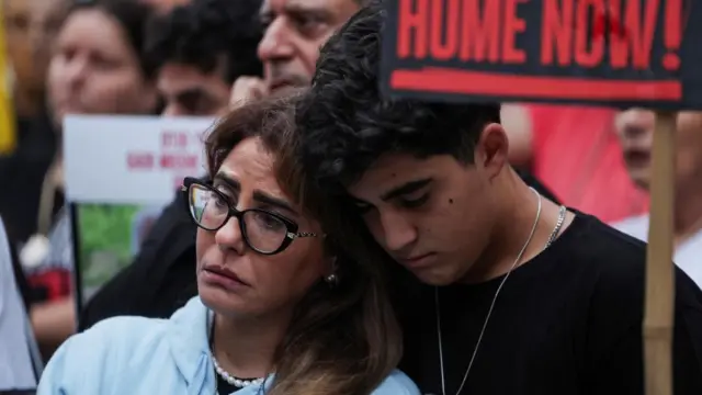 People attend a protest marking the first anniversary of the 7 October 2023 Hamas-led attack, next to the Israeli Prime Minister's residence in Jerusalem