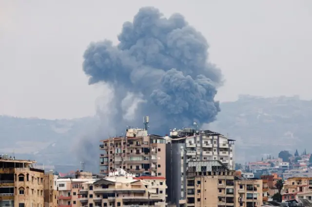 Close up of smoke billowing up from a built-up area of Tyre in southern Lebanon