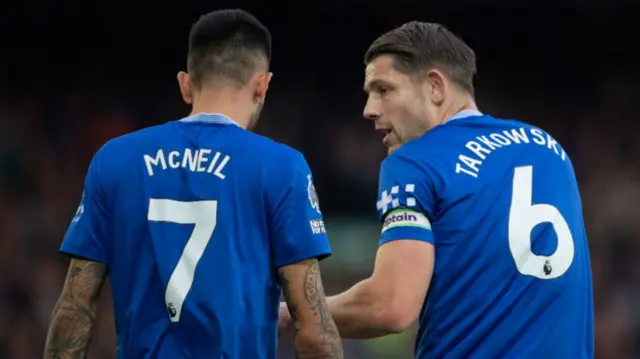 Everton defenders Dwight McNeil and James Tarkowski talking during the match against Newcastle United