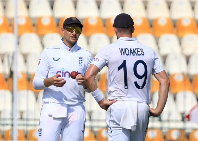 England's Joe Root and Chris Woakes