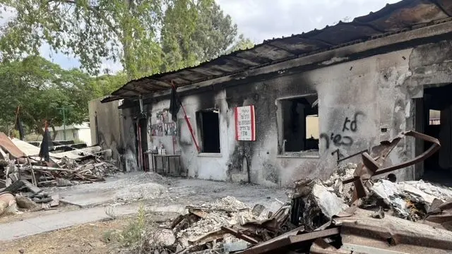 Charred remains of home in kibbutz Nir Oz one year after October 7 attack