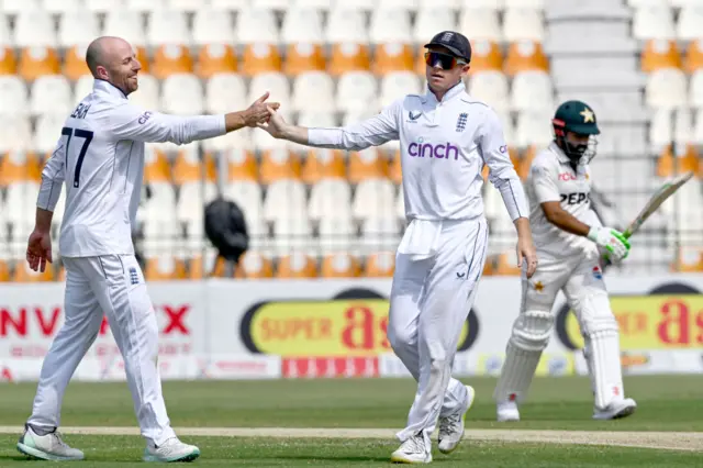 Jack Leach and Ollie Pope celebrate