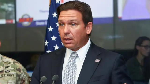 Ron DeSantis speaks about Hurricane Helene as Adjutant General of Florida Major General John Haas looks on during a press briefing at the Emergency Operations Center in Tallahassee, Florida, U.S