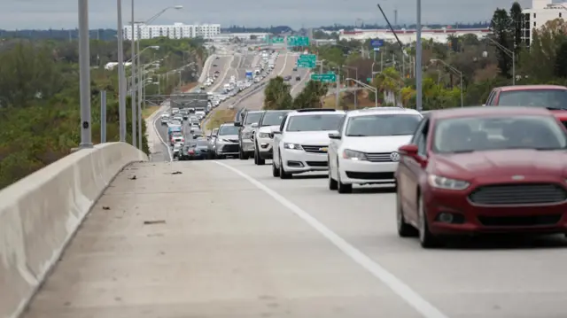 Heavy traffic begins to back up on Interstate 275 South as residents evacuate St. Petersburg, Florida