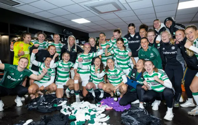 Celtic players celebrating in dressing room