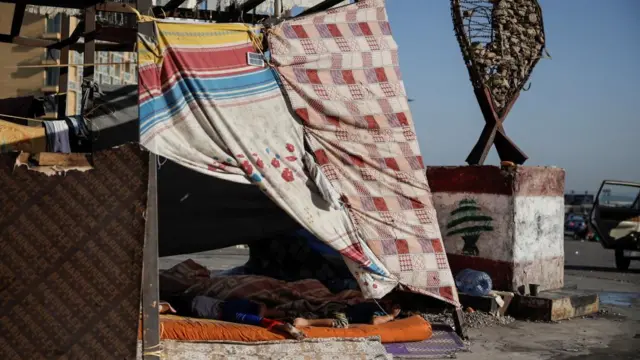 Displaced people sleep on the streets of Beirut