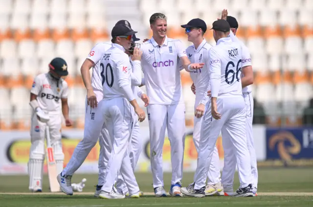 Brydon Carse and England celebrate the wicket of Naseem Shah