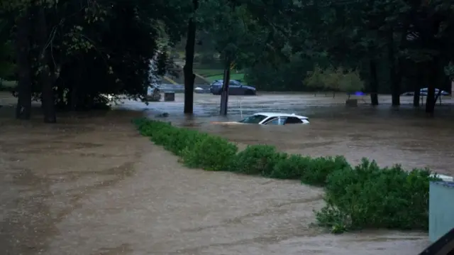 A flooded car left from Hurricane Helene in the Atlanta area