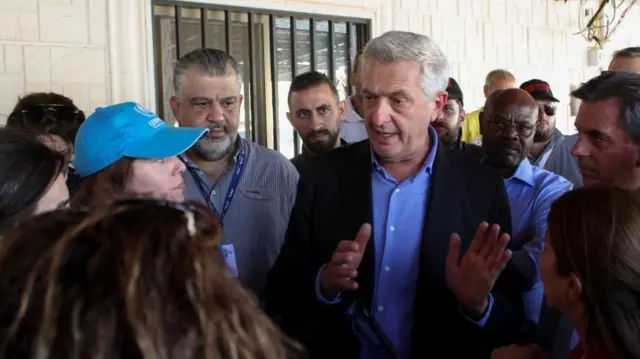 UN high commissioner for refugees Filippo Grandi visits the main border crossing between Syria and Lebanon on 7 Oct, 2024. He is talking to a crowd of people.