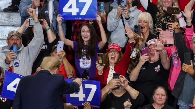 Trump interacting with supporters at a rally in Scranton, Pennsylvania