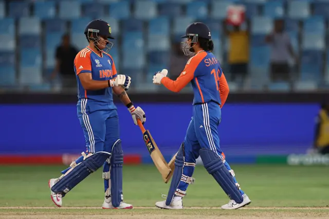 Smriti Mandhana and Shafali Verma of India speak in the middle