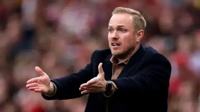 Arsenal women's manager Jonas Eidevall pointing while standing on the sideline