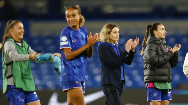 Chelsea manager Sonia Bompastor and her players applaud the team's fans after their Women's Champions League win at home to Real Madrid