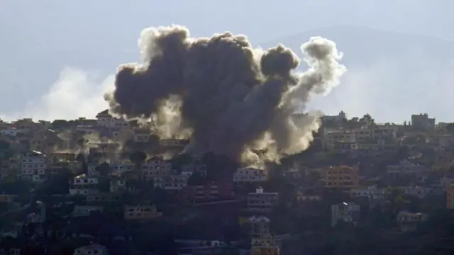 Smoke rises following air strikes by Israeli forces in Khiam near the Lebanese-Israeli border