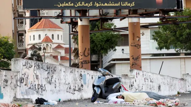 A man sleeps on the street in Beirut's Martyrs' Square.