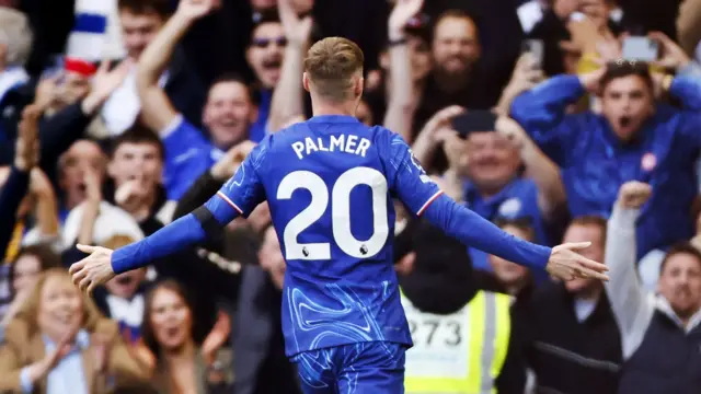 Cole Palmer celebrates scoring a goal for Chelsea