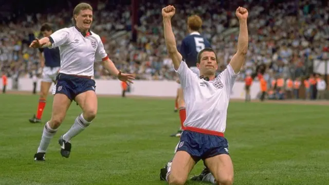 Steve Bull celebrates scoring for England against Scotland