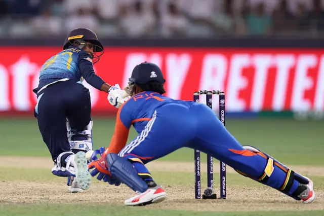 Sugandika Kumari of Sri Lanka looks back as she is caught by Richa Ghosha