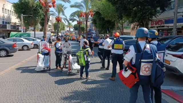 Medical workers operating on a street in Hadera